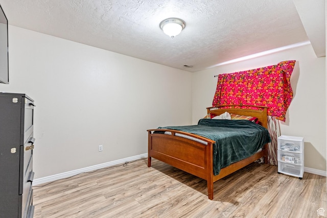 773 W 1280 S, Provo, UT 84601 - bedroom featuring light wood-type flooring, a textured ceiling, and baseboards