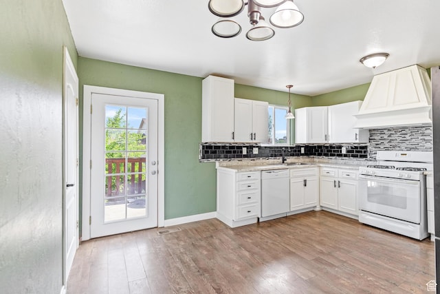 773 W 1280 S, Provo, UT 84601 - kitchen featuring white appliances, custom exhaust hood, tasteful backsplash, and healthy amount of natural light