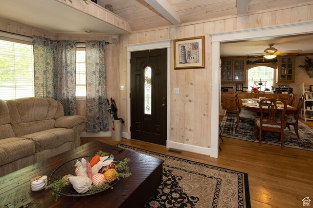 40 S Main St, Glenwood, UT 84730 - living room with beam ceiling, wood finished floors, a ceiling fan, baseboards, and wooden walls