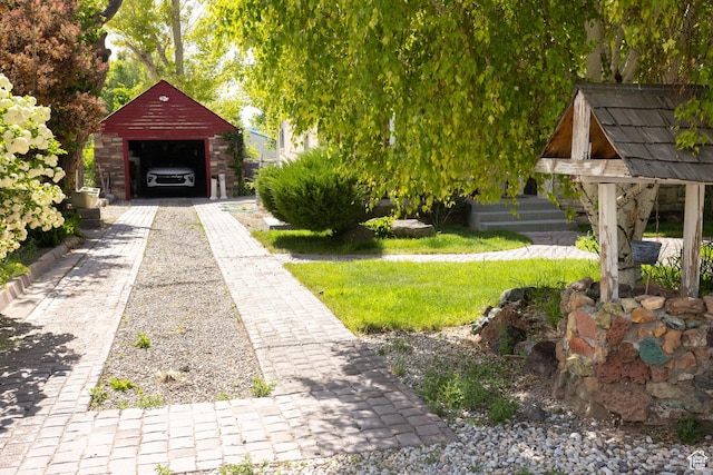 40 S Main St, Glenwood, UT 84730 - view of yard featuring a garage, an outdoor structure, and driveway