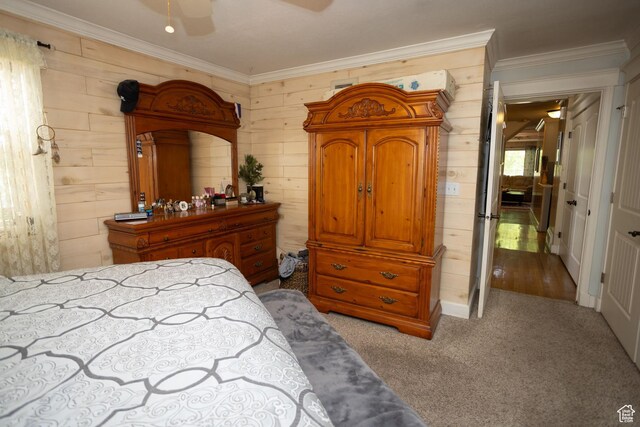 40 S Main St, Glenwood, UT 84730 - bedroom with ornamental molding, wood walls, carpet, and a ceiling fan