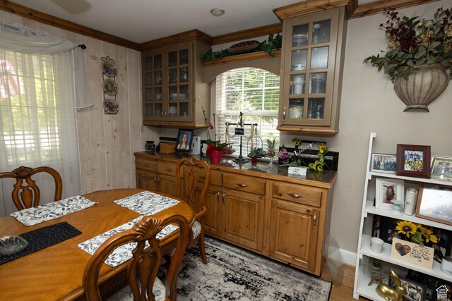40 S Main St, Glenwood, UT 84730 - dining area with light wood finished floors, ornamental molding, and wood walls