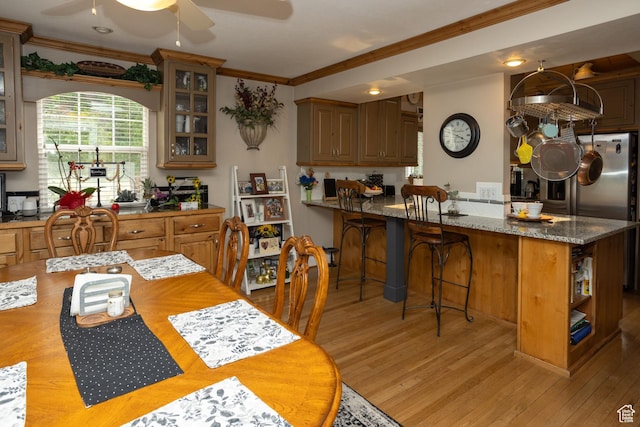 40 S Main St, Glenwood, UT 84730 - dining area featuring crown molding, a ceiling fan, and light wood-type flooring