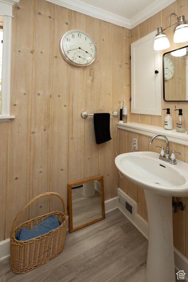 40 S Main St, Glenwood, UT 84730 - bathroom with baseboards, wood finished floors, wood walls, and ornamental molding