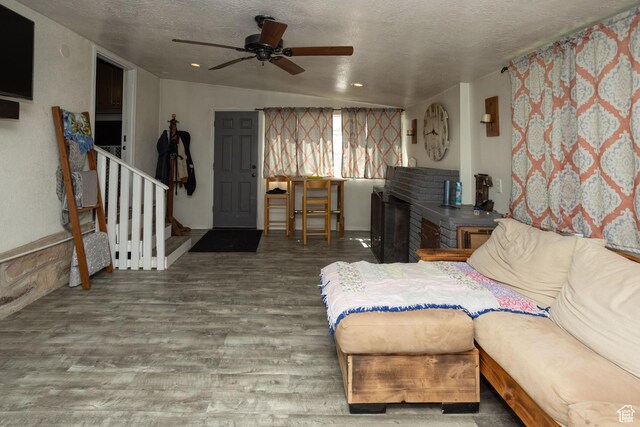 40 S Main St, Glenwood, UT 84730 - living room featuring a textured ceiling, ceiling fan, wood finished floors, stairway, and lofted ceiling