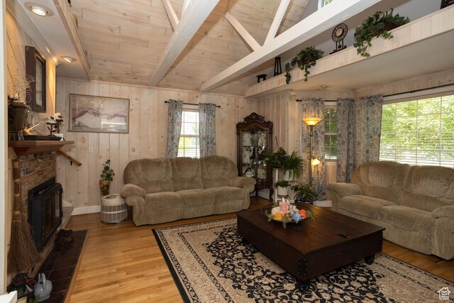 40 S Main St, Glenwood, UT 84730 - living room with wooden walls, light wood-type flooring, wood ceiling, and a brick fireplace