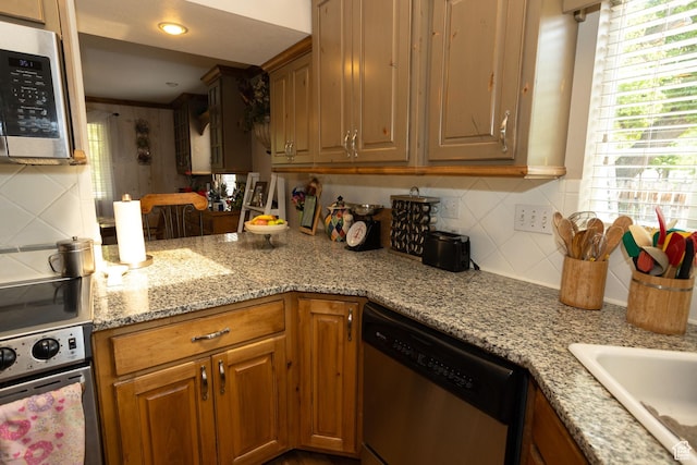 40 S Main St, Glenwood, UT 84730 - kitchen with stainless steel appliances, backsplash, light stone counters, brown cabinetry, and a sink