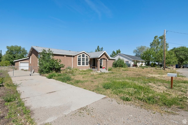 2554 S Chesterfield St W, West Valley City, UT 84119 - single story home with stucco siding and a gate