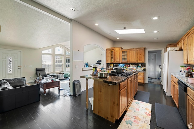 2554 S Chesterfield St W, West Valley City, UT 84119 - kitchen with a textured ceiling, lofted ceiling, open floor plan, a breakfast bar, and dishwasher