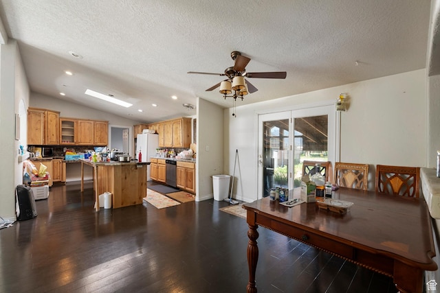 2554 S Chesterfield St W, West Valley City, UT 84119 - kitchen with appliances with stainless steel finishes, vaulted ceiling, a center island, a textured ceiling, and dark wood-type flooring