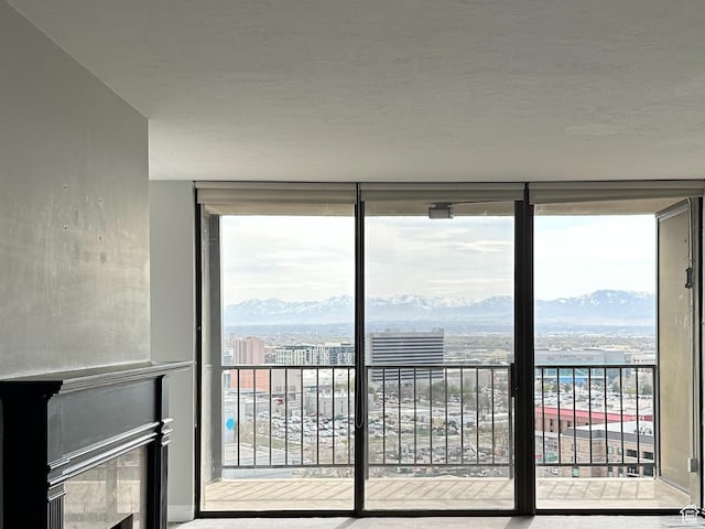 241 N Vine St W Unit 808W, Salt Lake City, UT 84103 - interior space with expansive windows, access to outside, a mountain view, and a view of city