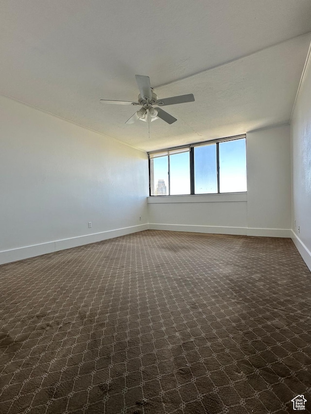 241 N Vine St W Unit 808W, Salt Lake City, UT 84103 - unfurnished room featuring ceiling fan and dark colored carpet