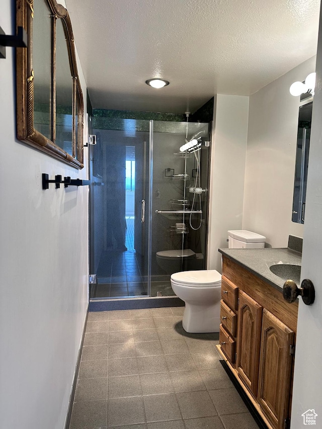 241 N Vine St W Unit 808W, Salt Lake City, UT 84103 - full bathroom with toilet, a shower stall, vanity, a textured ceiling, and baseboards