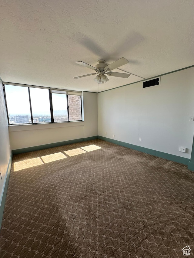 241 N Vine St W Unit 808W, Salt Lake City, UT 84103 - empty room featuring a ceiling fan, carpet floors, baseboards, and a textured ceiling