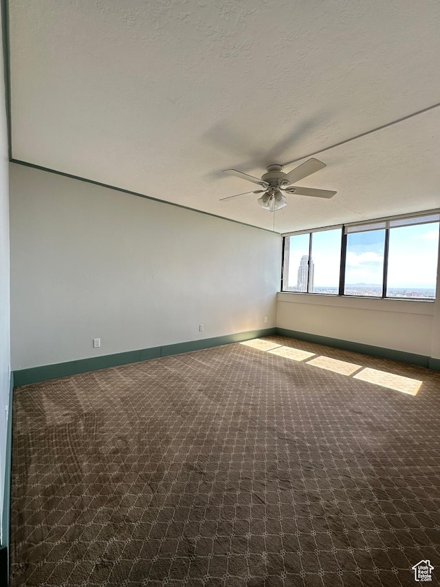 241 N Vine St W Unit 808W, Salt Lake City, UT 84103 - carpeted spare room featuring ceiling fan and baseboards
