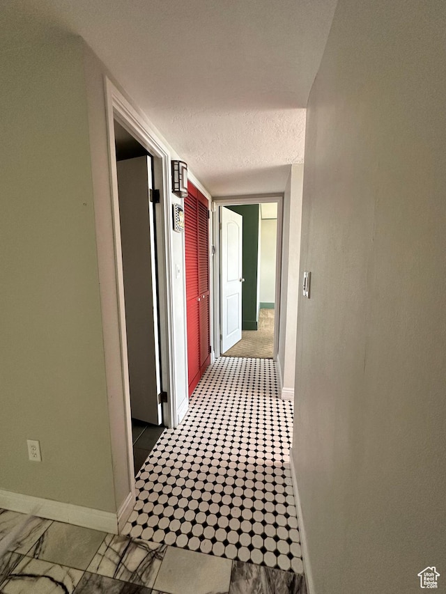 241 N Vine St W Unit 808W, Salt Lake City, UT 84103 - corridor featuring baseboards and a textured ceiling