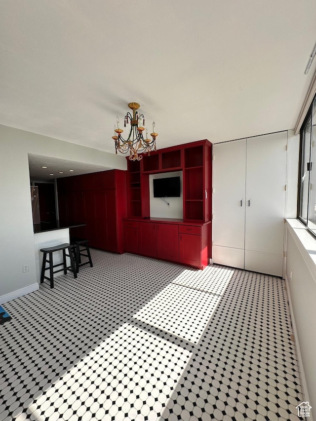 241 N Vine St W Unit 808W, Salt Lake City, UT 84103 - unfurnished dining area featuring a chandelier and baseboards
