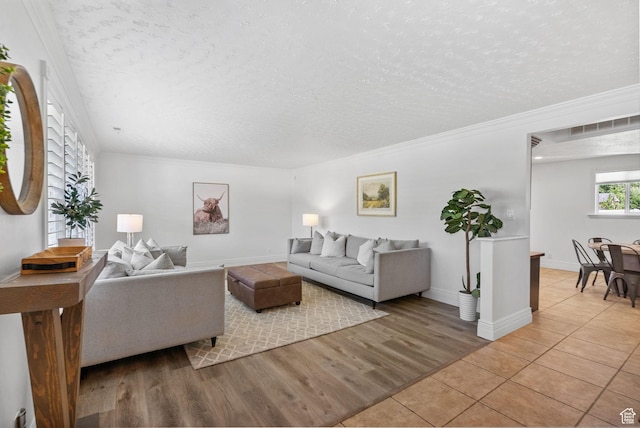 993 E 12600 S, Draper, UT 84020 - living room with a textured ceiling, ornamental molding, light tile patterned floors, and baseboards