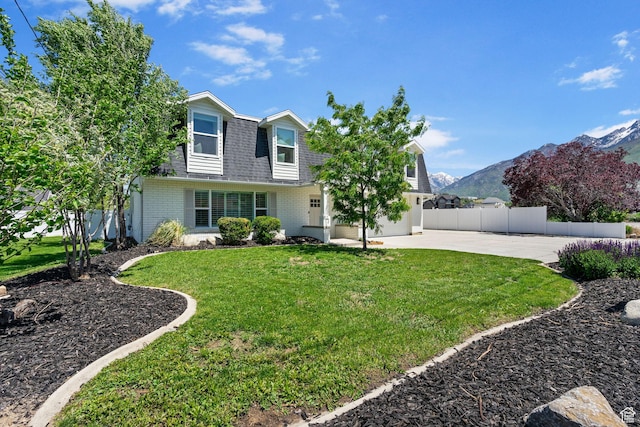993 E 12600 S, Draper, UT 84020 - view of front facade featuring a shingled roof, driveway, a mountain view, and brick siding