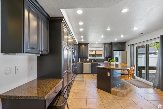 993 E 12600 S, Draper, UT 84020 - kitchen featuring dishwasher, recessed lighting, a kitchen breakfast bar, healthy amount of natural light, and light tile patterned floors
