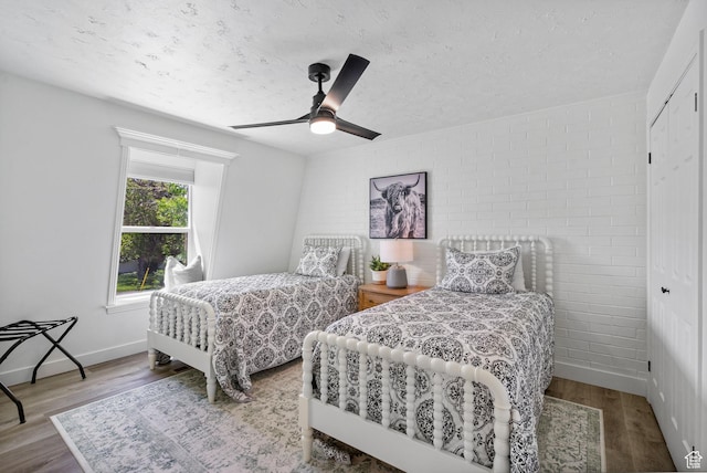 993 E 12600 S, Draper, UT 84020 - bedroom featuring wood finished floors, a textured ceiling, a ceiling fan, and baseboards