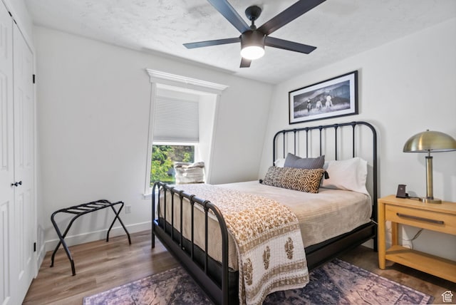 993 E 12600 S, Draper, UT 84020 - bedroom featuring a closet, wood finished floors, a ceiling fan, and baseboards