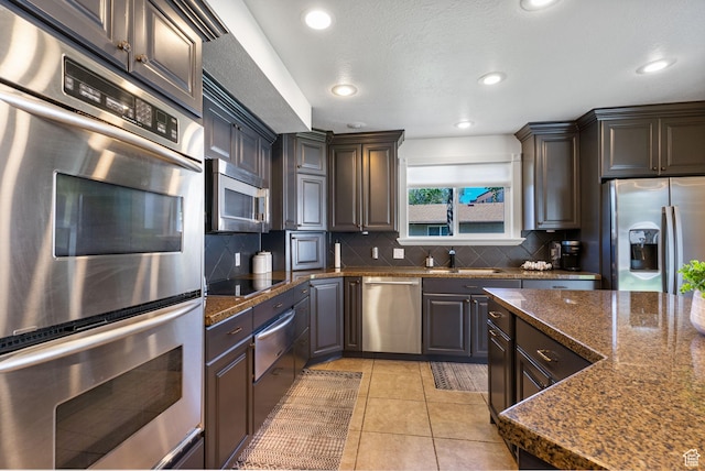 993 E 12600 S, Draper, UT 84020 - kitchen with stainless steel appliances, a warming drawer, tasteful backsplash, recessed lighting, and light tile patterned floors