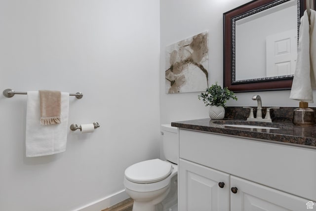 13226 S Cocomo Ct W, Herriman, UT 84096 - half bathroom featuring vanity, toilet, wood finished floors, and baseboards