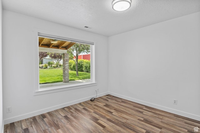 13226 S Cocomo Ct W, Herriman, UT 84096 - spare room featuring wood finished floors, baseboards, and a textured ceiling