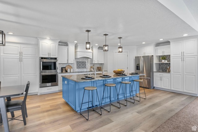 13226 S Cocomo Ct W, Herriman, UT 84096 - kitchen featuring stainless steel appliances, white cabinets, decorative backsplash, and recessed lighting