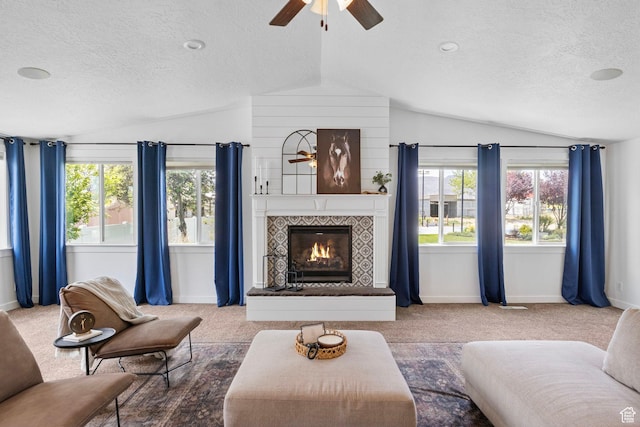 13226 S Cocomo Ct W, Herriman, UT 84096 - living room featuring a ceiling fan, lofted ceiling, a textured ceiling, baseboards, and carpet