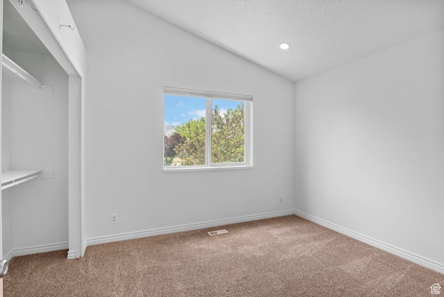 13226 S Cocomo Ct W, Herriman, UT 84096 - unfurnished bedroom featuring carpet, lofted ceiling, a textured ceiling, baseboards, and recessed lighting