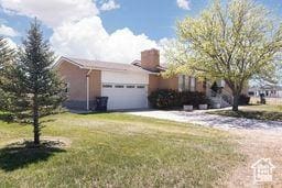 330 N 100 E, Centerfield, UT 84622 - view of front of property with a front lawn and a garage