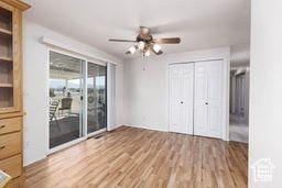 330 N 100 E, Centerfield, UT 84622 - unfurnished bedroom with access to outside, wood finished floors, a ceiling fan, and a closet