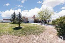 330 N 100 E, Centerfield, UT 84622 - view of front facade featuring an attached garage and a front yard