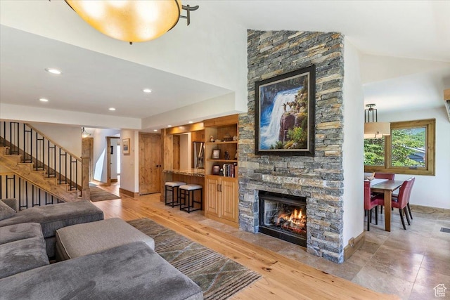 1825 S 1666th Dr E, Bountiful, UT 84010 - living room featuring a fireplace, stairs, recessed lighting, baseboards, and high vaulted ceiling