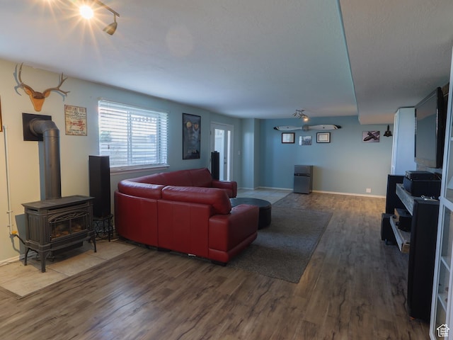 113 N 4950 W, West Point, UT 84015 - living room featuring wood finished floors, a wood stove, and baseboards