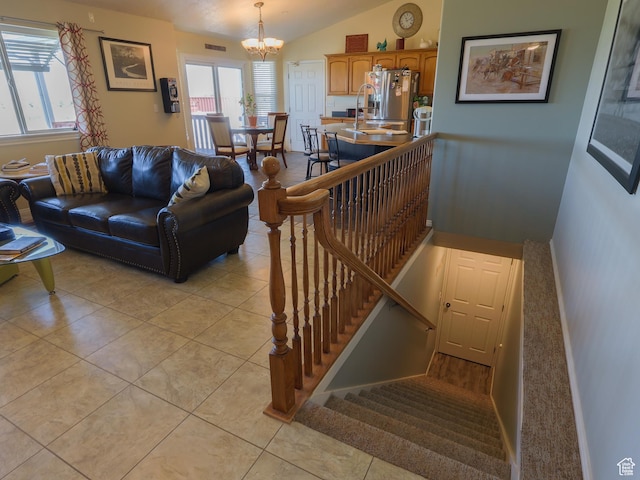113 N 4950 W, West Point, UT 84015 - living room with a chandelier, plenty of natural light, light tile patterned flooring, lofted ceiling, and stairway