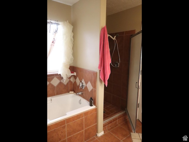 113 N 4950 W, West Point, UT 84015 - bathroom featuring tile patterned floors, a shower stall, and a garden tub