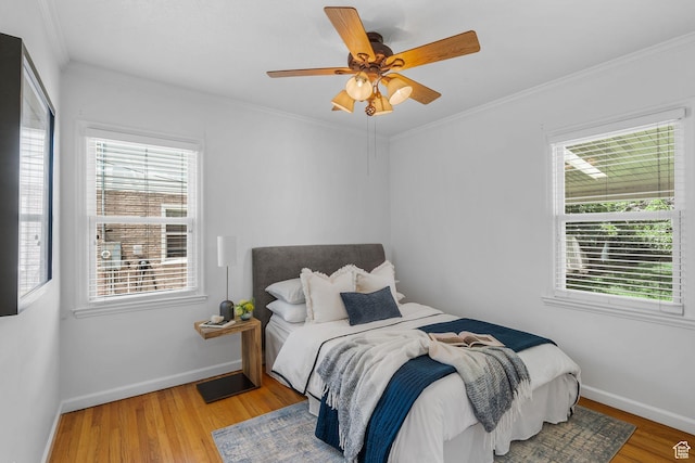 1861 E Ramona Ave, Salt Lake City, UT 84108 - bedroom featuring multiple windows, wood finished floors, baseboards, and crown molding