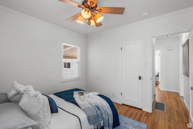 1861 E Ramona Ave, Salt Lake City, UT 84108 - bedroom with light wood-type flooring, ornamental molding, a ceiling fan, and baseboards