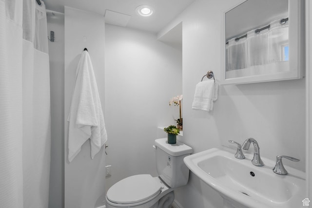 1861 E Ramona Ave, Salt Lake City, UT 84108 - bathroom featuring a sink, toilet, and a shower with curtain