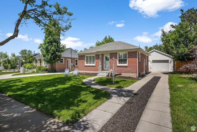 1861 E Ramona Ave, Salt Lake City, UT 84108 - bungalow-style home with brick siding, an outdoor structure, a front lawn, driveway, and a detached garage