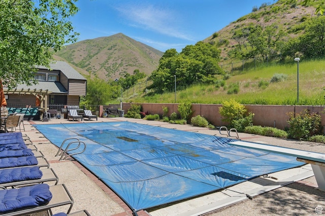 12 N Quiet Meadow Ln, Mapleton, UT 84664 - view of pool featuring a mountain view, a diving board, and a patio