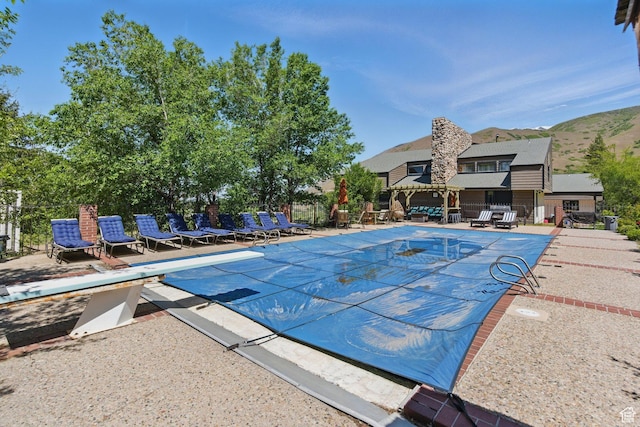 12 N Quiet Meadow Ln, Mapleton, UT 84664 - view of swimming pool featuring a diving board and a patio