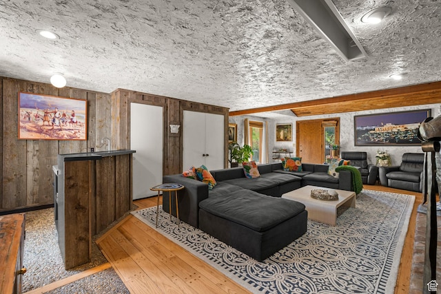 12 N Quiet Meadow Ln, Mapleton, UT 84664 - living room featuring wood walls and light wood-style floors