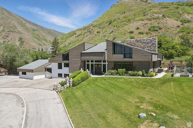12 N Quiet Meadow Ln, Mapleton, UT 84664 - view of front of house with a mountain view and a front lawn