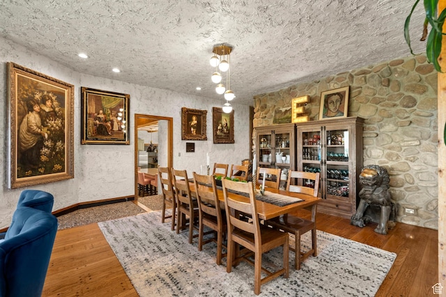 12 N Quiet Meadow Ln, Mapleton, UT 84664 - dining room with hardwood / wood-style floors, baseboards, and a textured ceiling