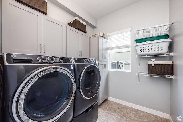 5067 W Beach Comber Way S, South Jordan, UT 84009 - washroom with washing machine and clothes dryer, cabinet space, baseboards, and light colored carpet