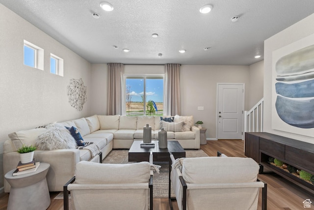 213 E 400 N Unit 980, Saratoga Springs, UT 84045 - living room featuring healthy amount of natural light, wood finished floors, recessed lighting, and a textured ceiling